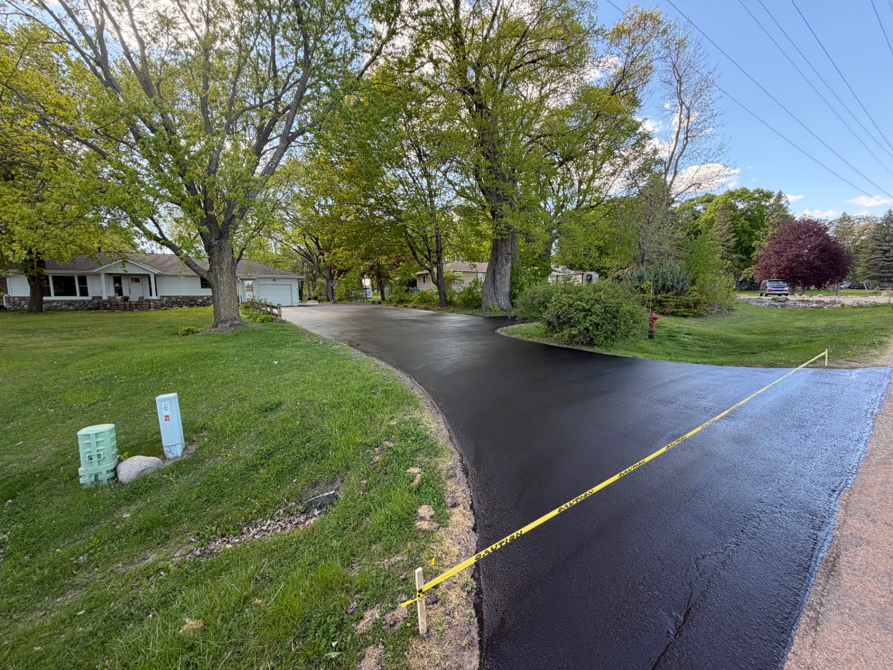 Freshly seal coated asphalt driveway in Watertown, MN